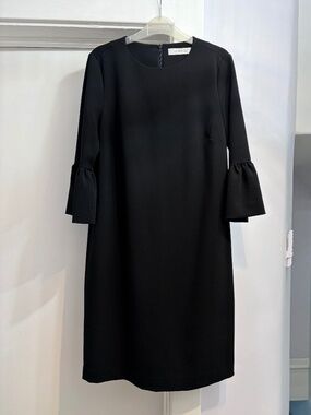 Simons (2) black midi dress with round neck and 3/4 ruffled sleeves.